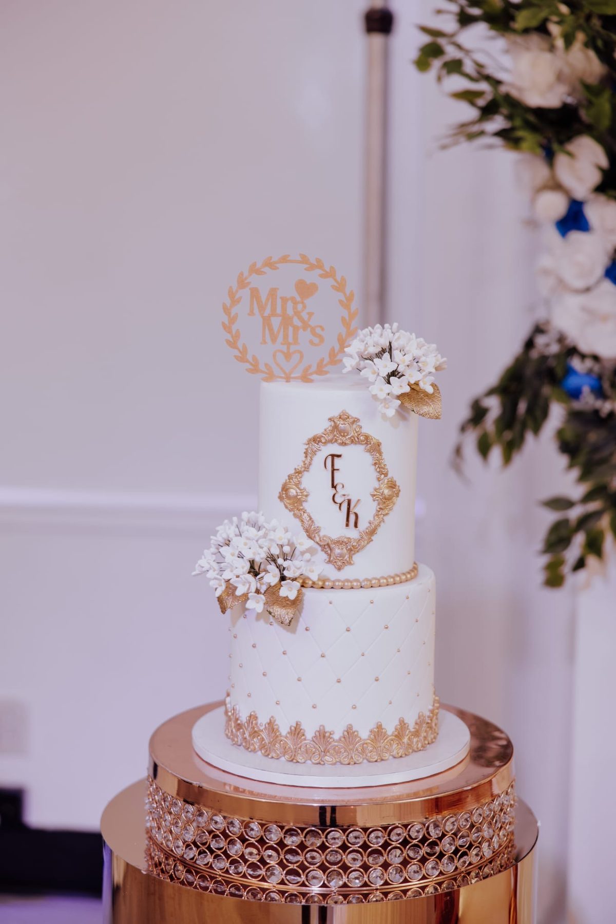 White and gold Mr and Mrs tiered wedding cake at Regency Party Hall