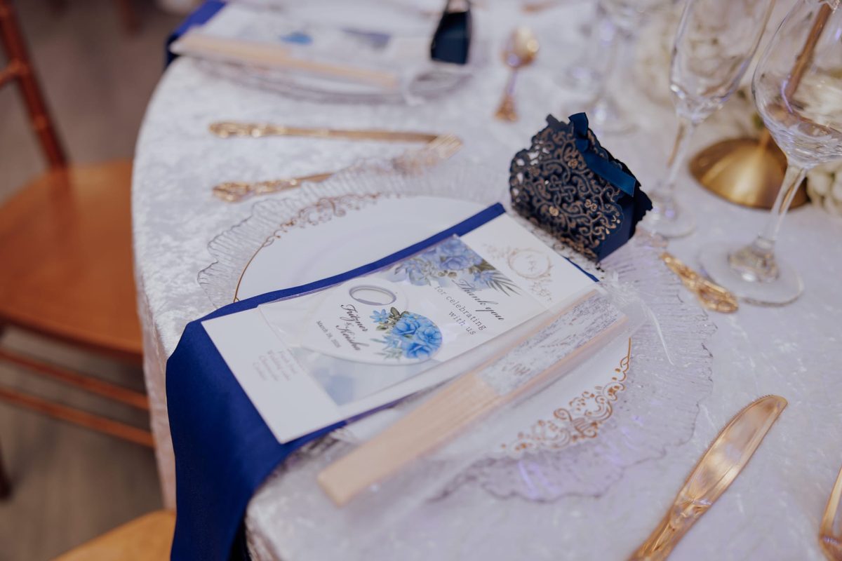 Elegant navy and gold wedding table setting at Regency Party Hall Queens Village